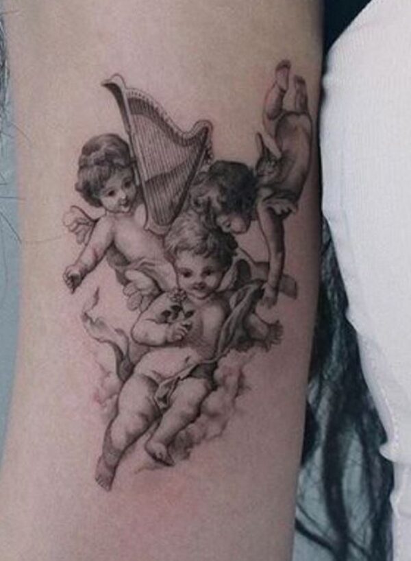 Trio-Of-Cherub-And-Harp-Tattoos-6959425-7837292