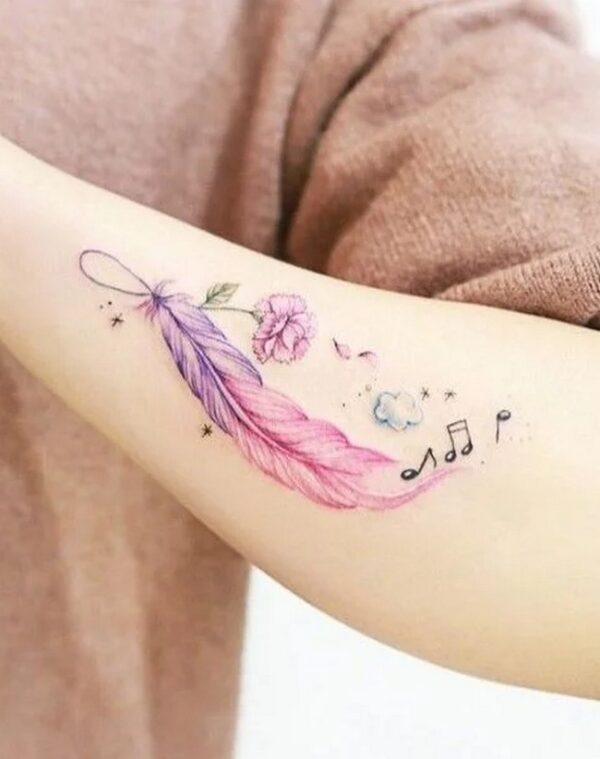 A Feather, A Flower, And Musical Notes Tattoo