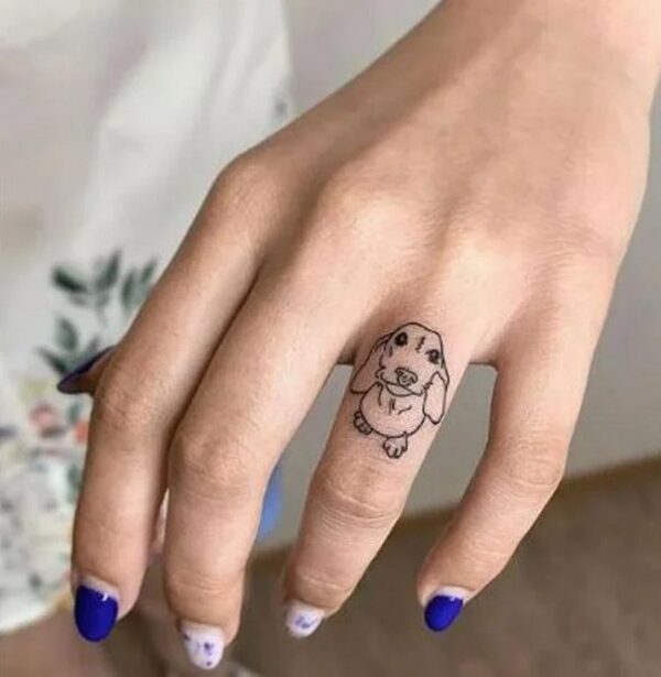 Dog On Ring Finger Tattoo