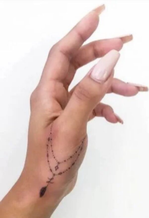 Hanging Chain On The Thumb Tattoo