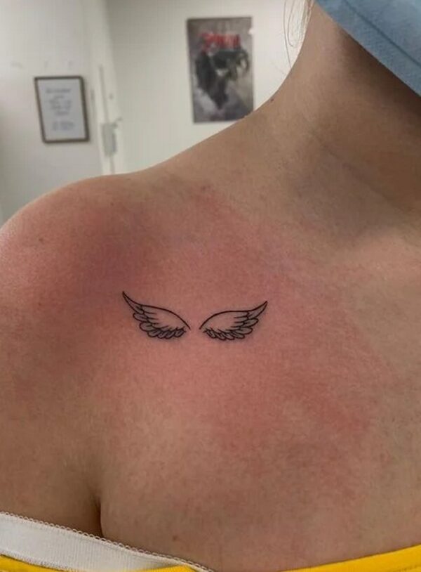 Minimalist Wings Tattoo