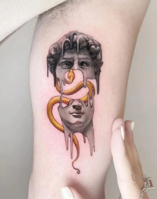 Snake And David Statue Tattoo