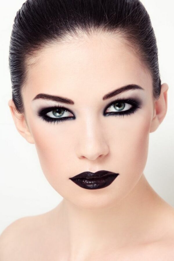 Woman Black Eye Makeup And Black Lipstick 