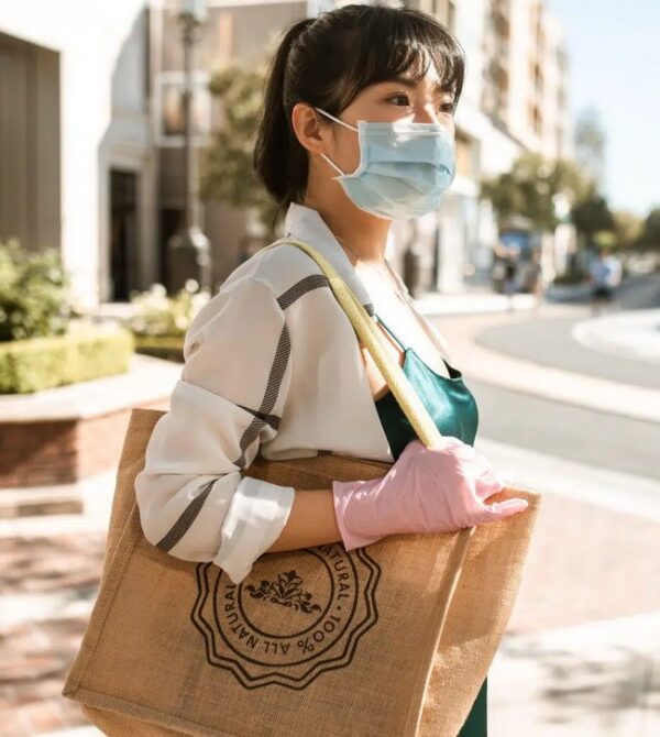 A Lady With A Mask And Curtain Bangs